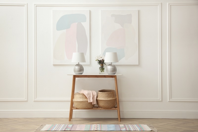 Console Table Symmetrical Lamps and Pastel Entryway Decor
