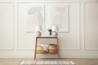 Console Table Symmetrical Lamps and Pastel Entryway Decor