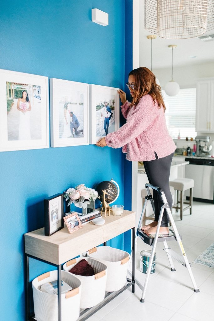 Console Table with Royal Blue Accent Wall and White Gallery Wall