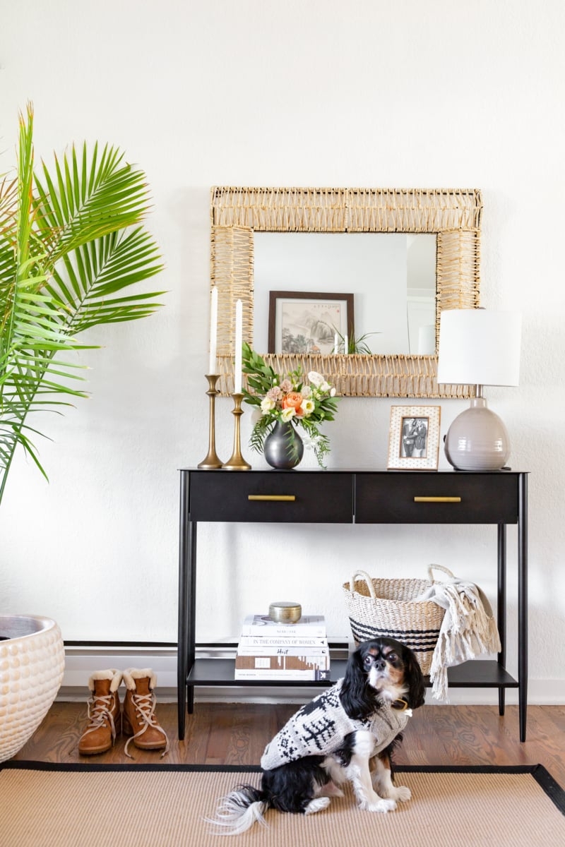 Console Table with Woven Mirror Frame for Transitional Foyer Design