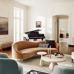 Curved Sofa: Cognac Velvet and Stone Pedestal Tables