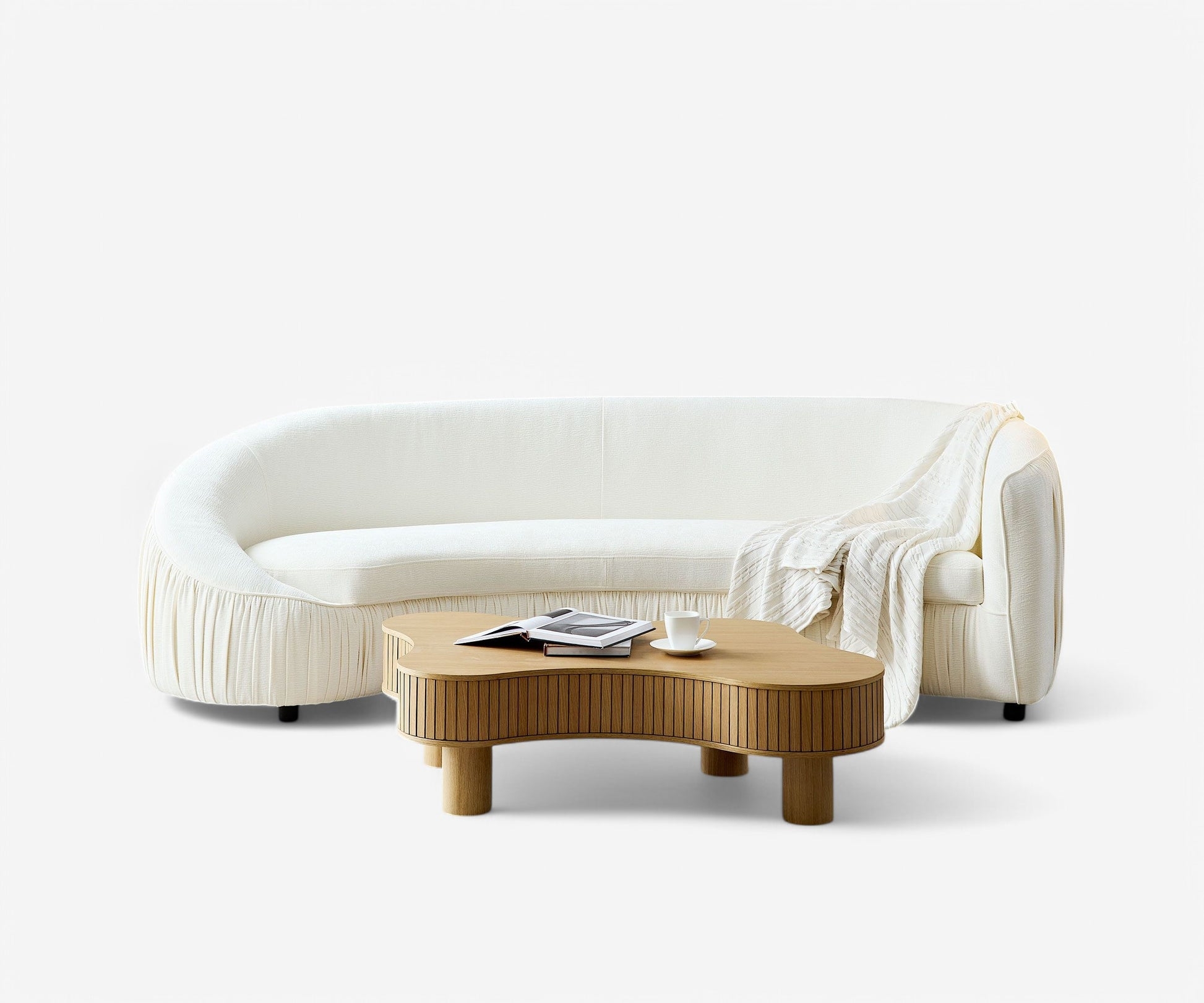 Curved Sofa featuring Pleated Base and Asymmetrical Back Silhouette