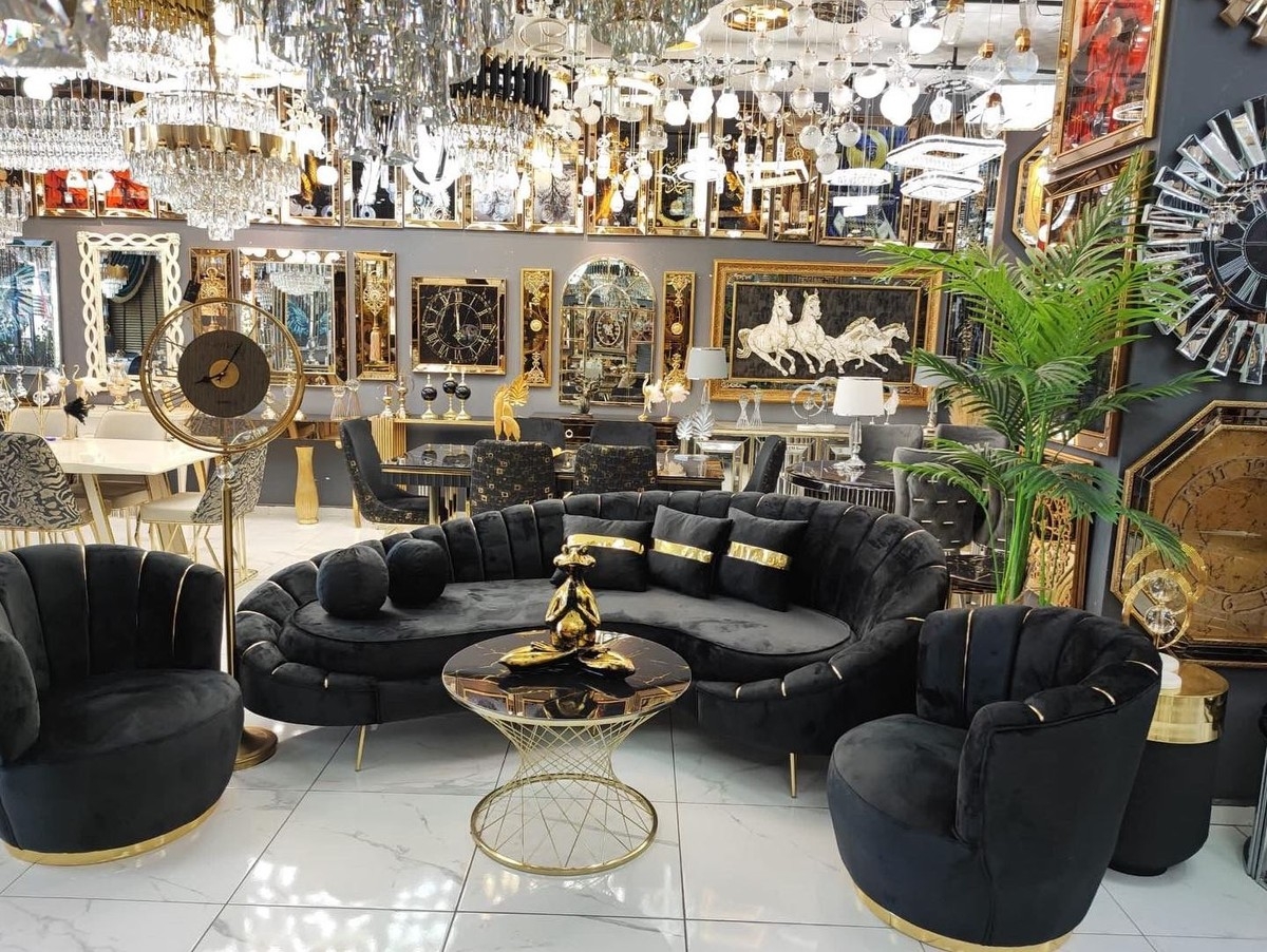 Curved Sofa with Gold Band Accents and Channel Tufted Back