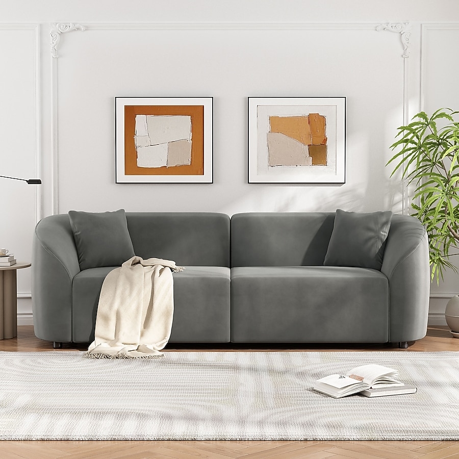 Curved Sofa with Plush Grey Upholstery and Streamlined Design