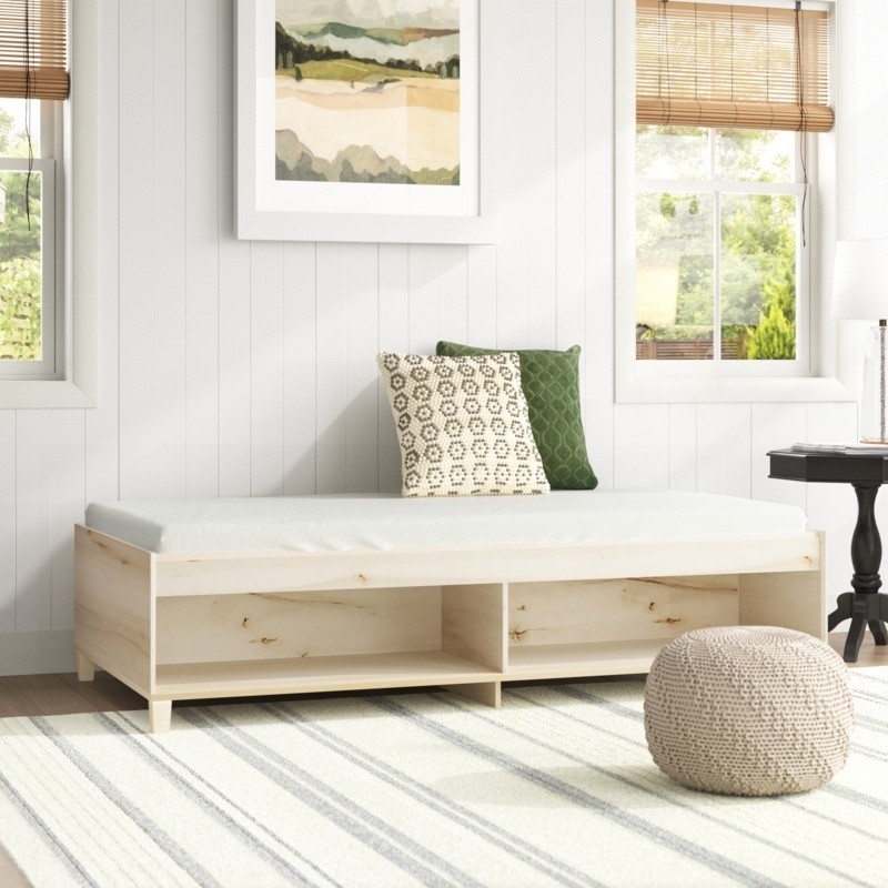 Daybed: Integrated Shelving and Light Natural Wood