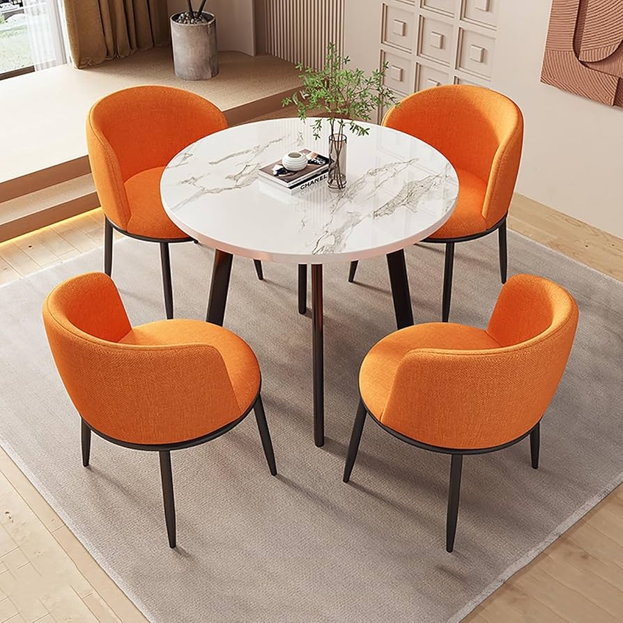 Dining Set with Marble Veined Top and Orange Barrel Dining Chairs