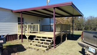 Elevated Deck Maroon Trim Covered Deck With Stairs