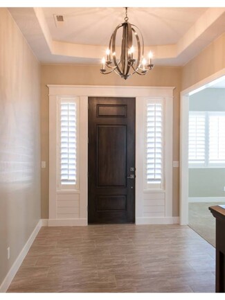 Entry Door Dark Wood Toned Door Orb Chandelier Sidelights
