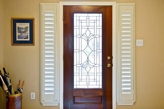 Entry Door Stained Glass Motif Wood and White Contrast
