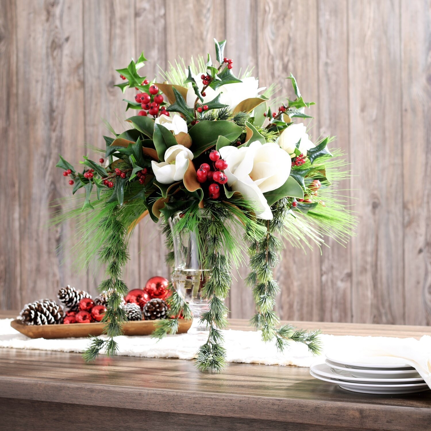Floral Arrangement: Ivory Magnolias and Draping Evergreen Garland