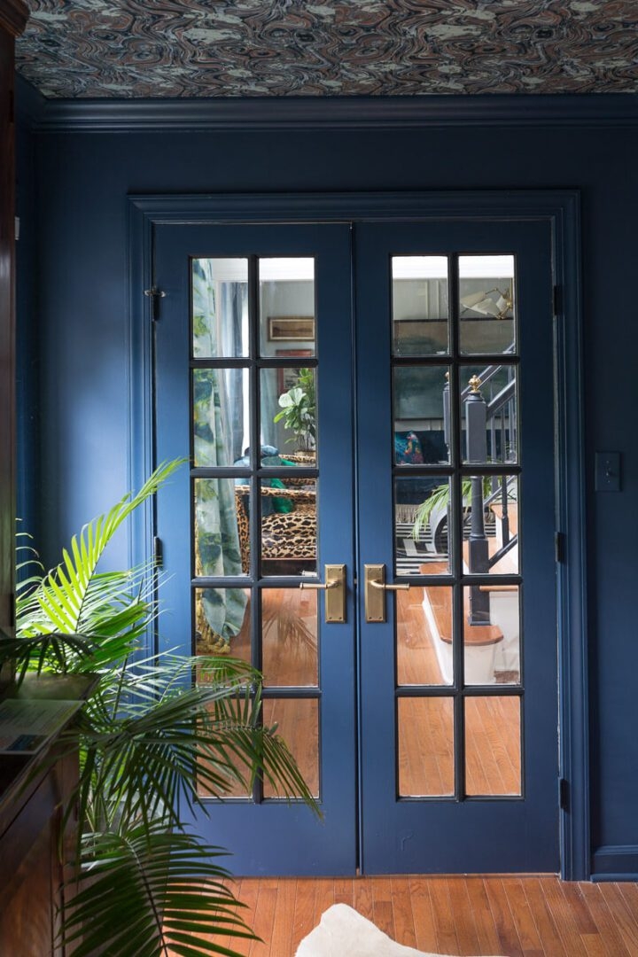 French Doors with Satin Brass Hardware and Moody Blue Entryway Style