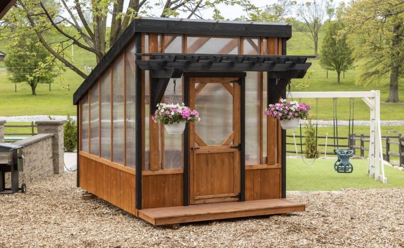 Greenhouse Shed with Pergola Overhang and Black Trim