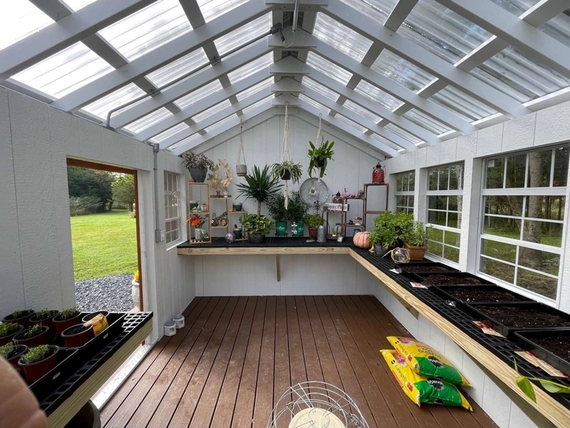 Greenhouse with L-Shaped Bench and White Painted Rafters