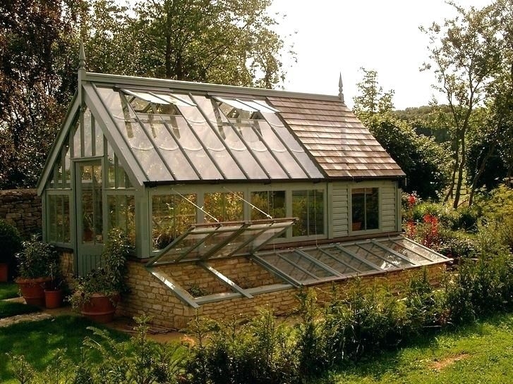 Greenhouse with Sage Green Frame and Stone Foundation