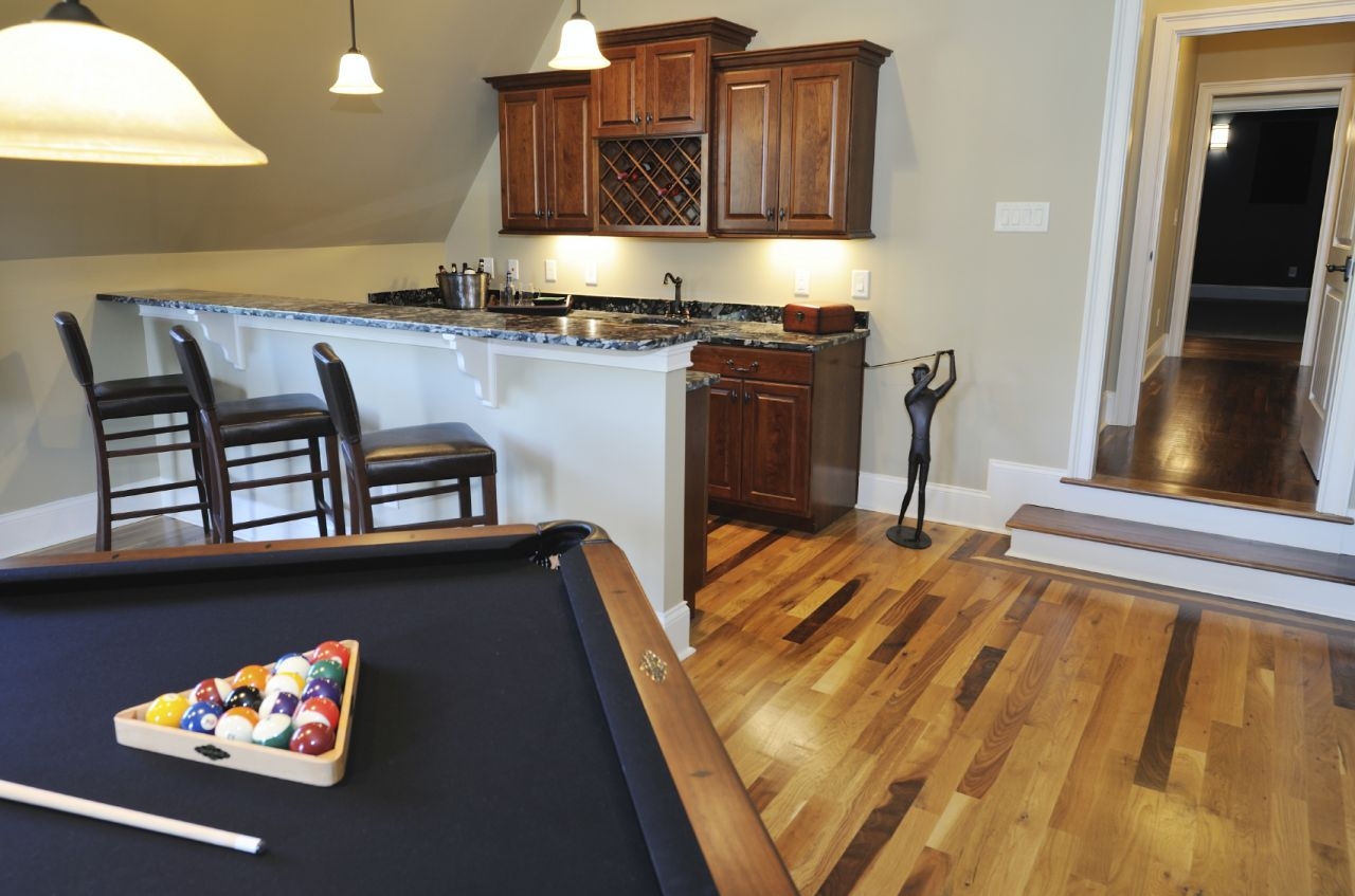 Home Bar: Traditional Man Cave Bar and Built In Wine Rack
