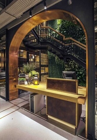 Hostess Stand Copper Archway and Vertical Garden with Thick Slab