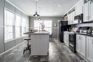 Kitchen Island with Black Appliances and Grey Kitchen Design