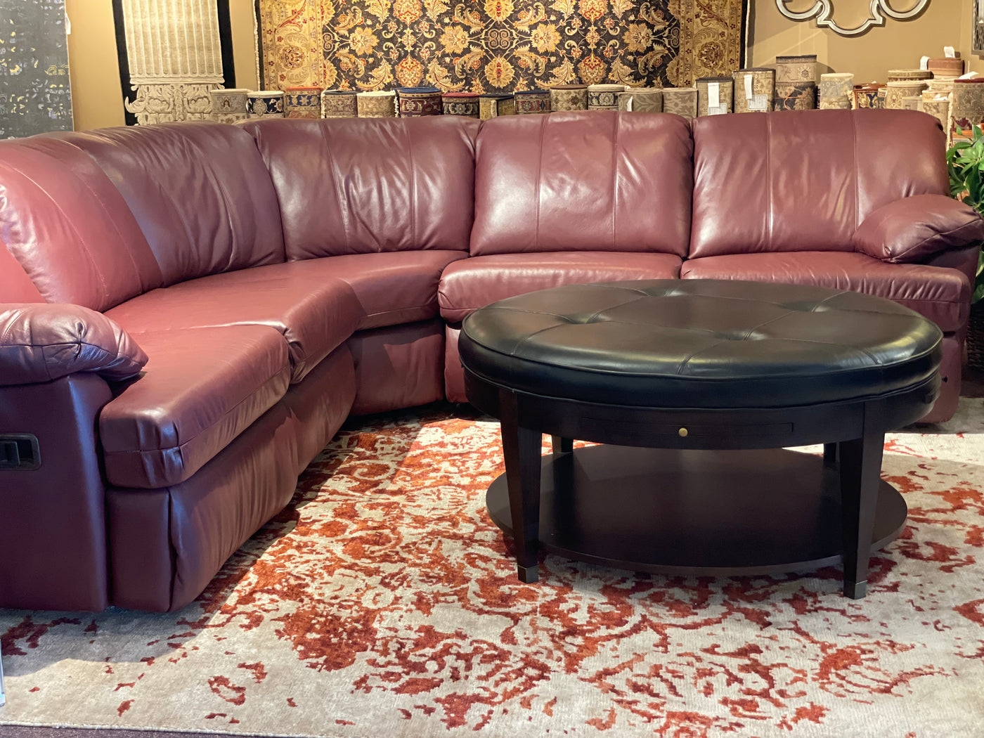 Leather Sectional with Tufted Ottoman and Curved Reclining Sofa