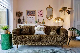 Leopard Print Sofa with Palm Tree Lamps and Pink Maximalist Living Room