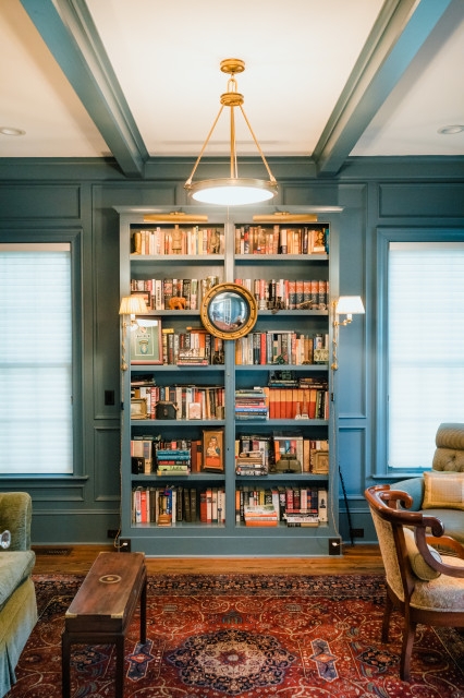 Library Bookshelf with Teal Millwork and Swing Arm Sconces