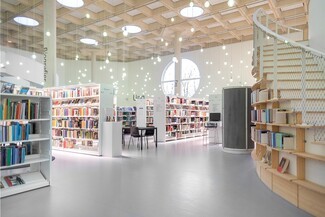 Library Shelving with Globe Pendants and Modern Waffle Ceiling