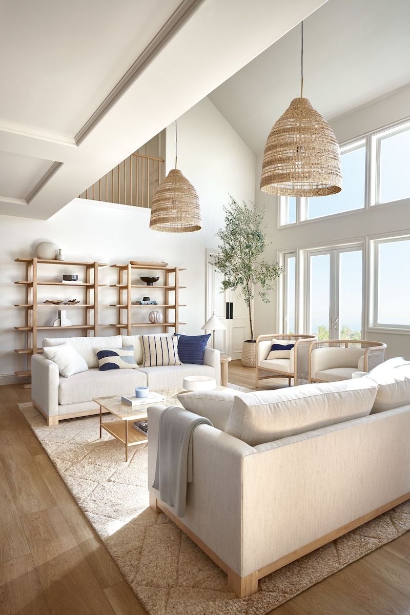 Living Room Layout with Oversized Woven Pendants and Cane Chairs