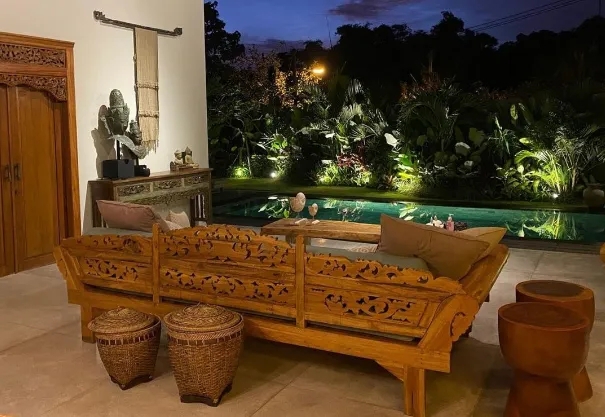 Lounge Sofa with Carved Fretwork and Poolside View