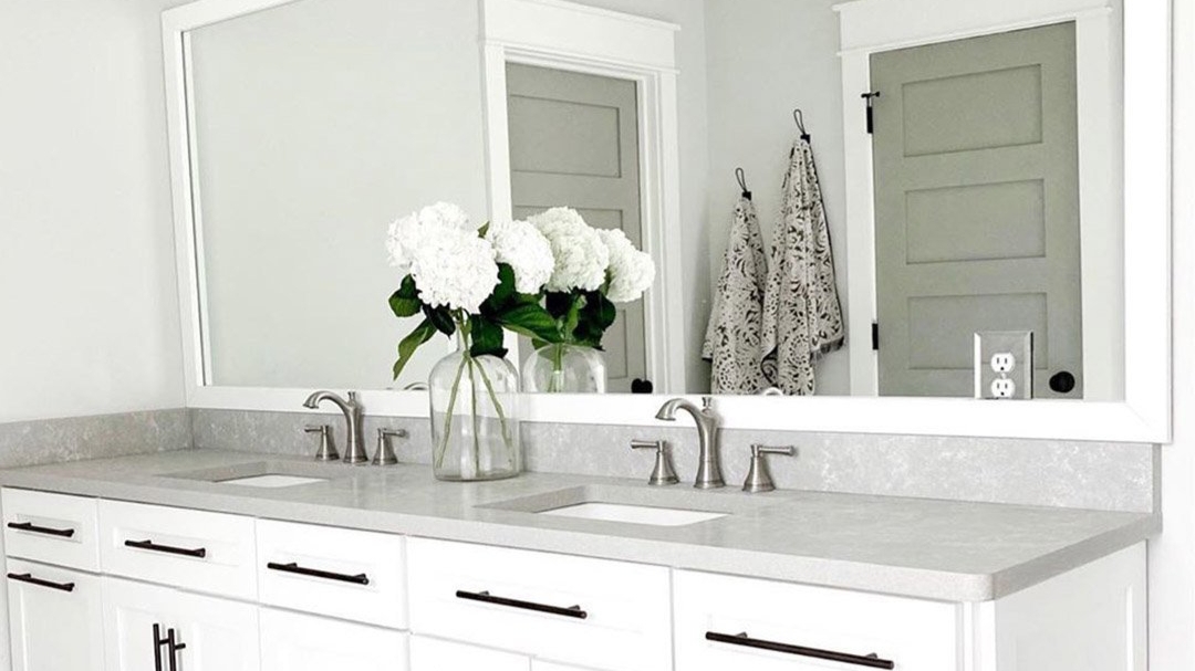 Mirror Frame with Wide Molding and Crisp White Bathroom Styling