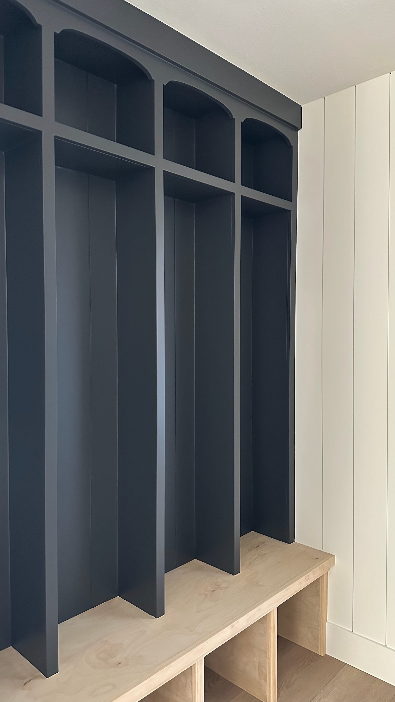 Mudroom Built In: Arched Mudroom Cubbies with Navy Wood Entryway