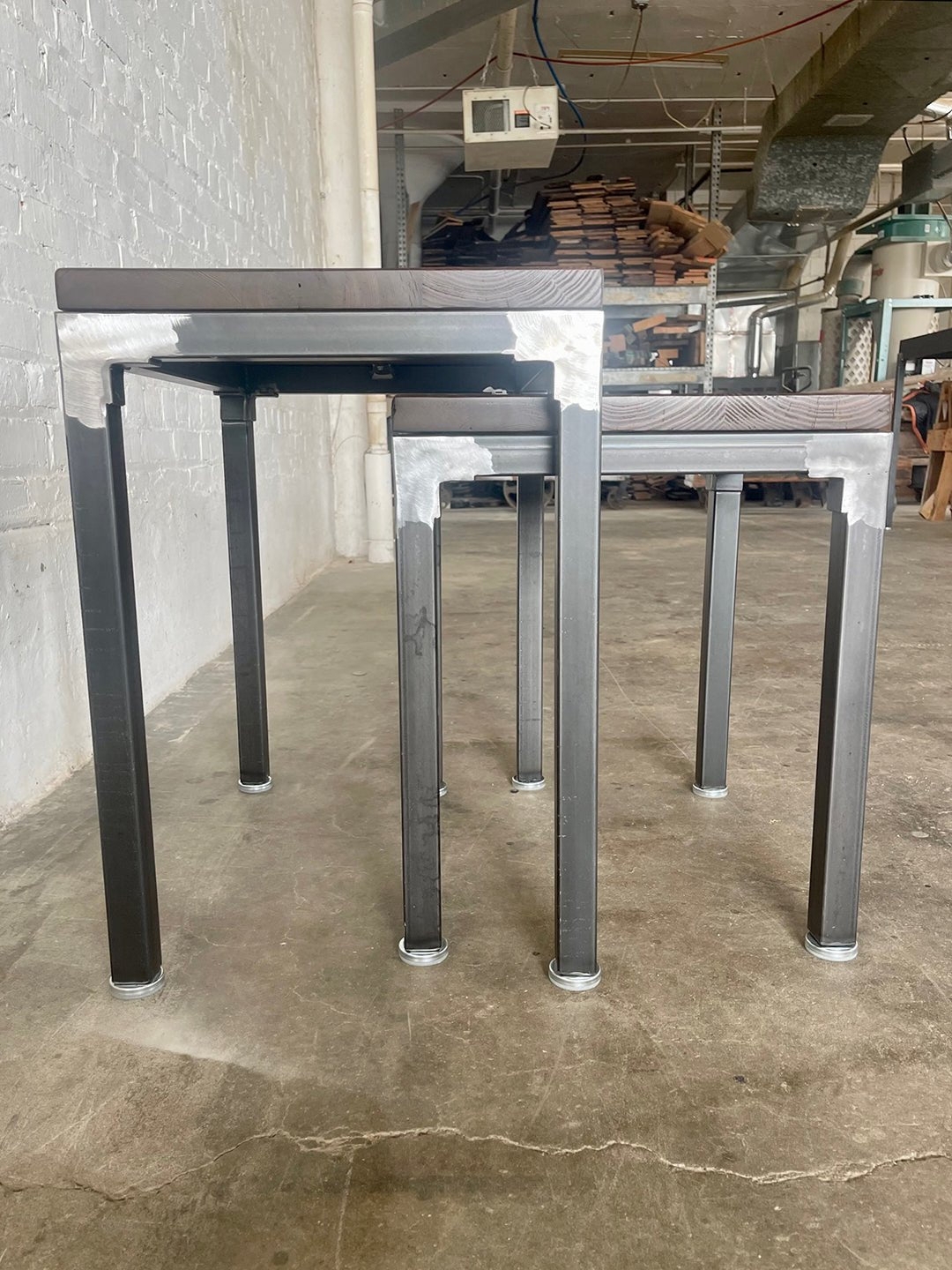 Nesting Tables: Industrial Raw Metal with Exposed Welds