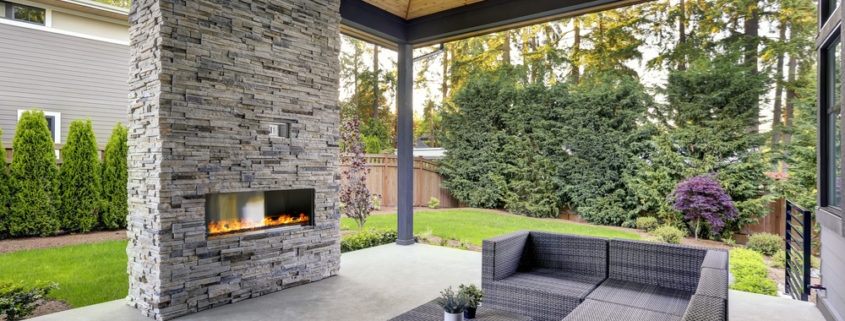 Outdoor Fireplace: Contemporary Backyard Stone Pillar Linear Gas