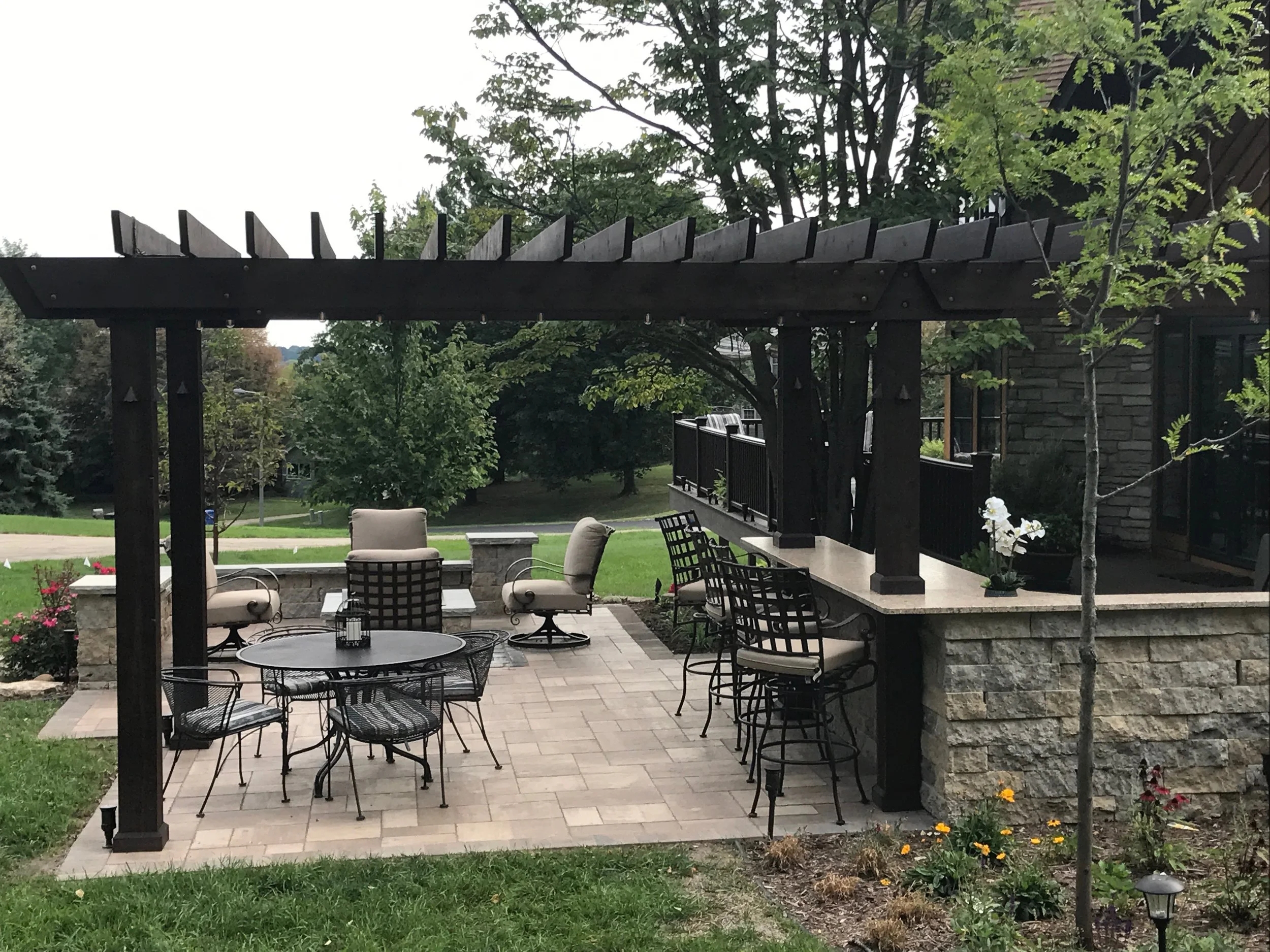 Outdoor Living Space Multi Zone Seating Dark Wood Pergola