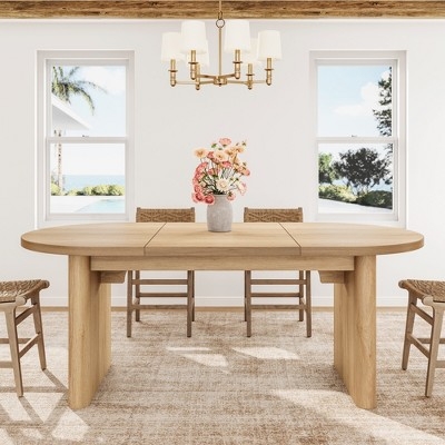 Oval Dining Table Has Slab Legs Blonde Wood Finish