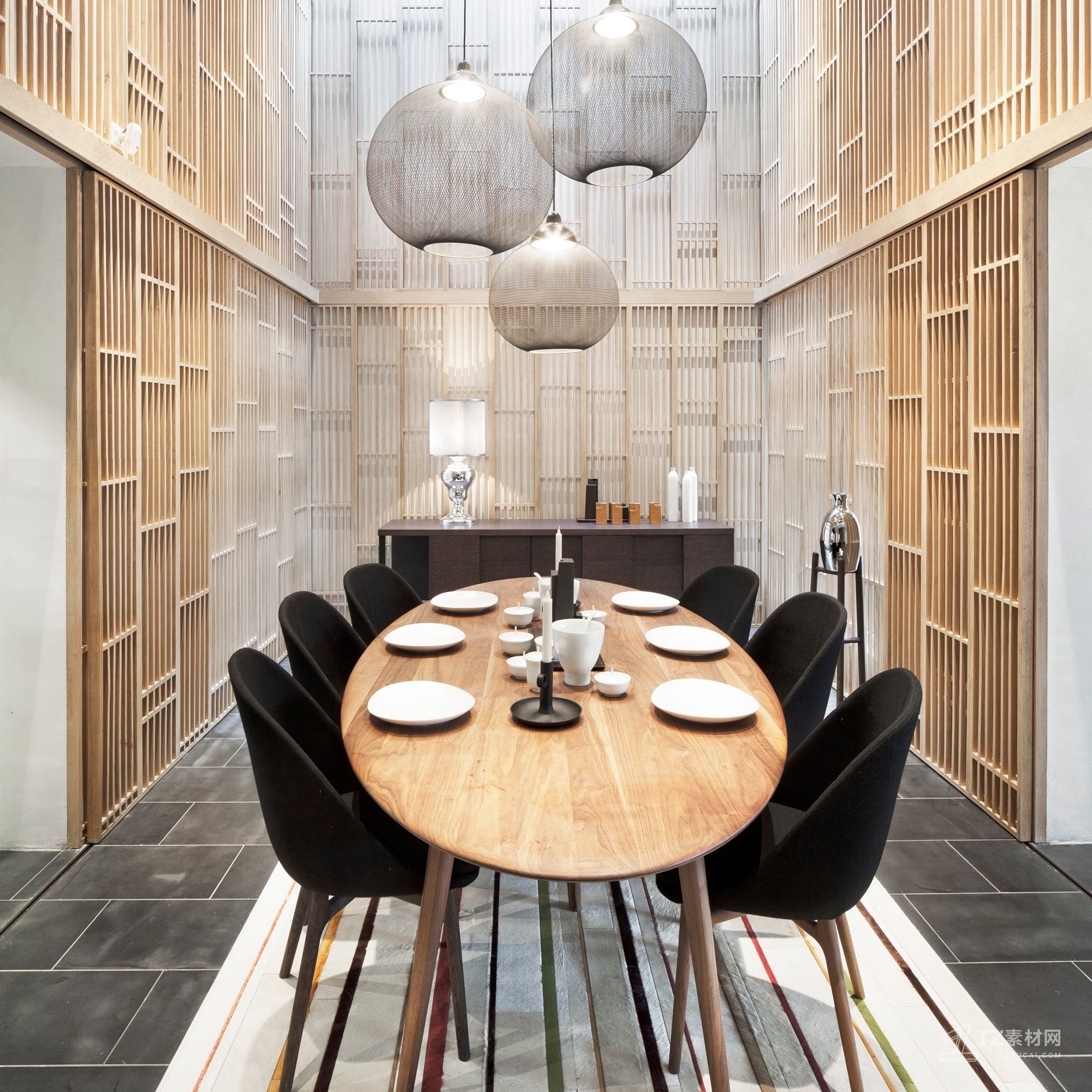 Oval Dining Table Presents Slat Wall Backdrop