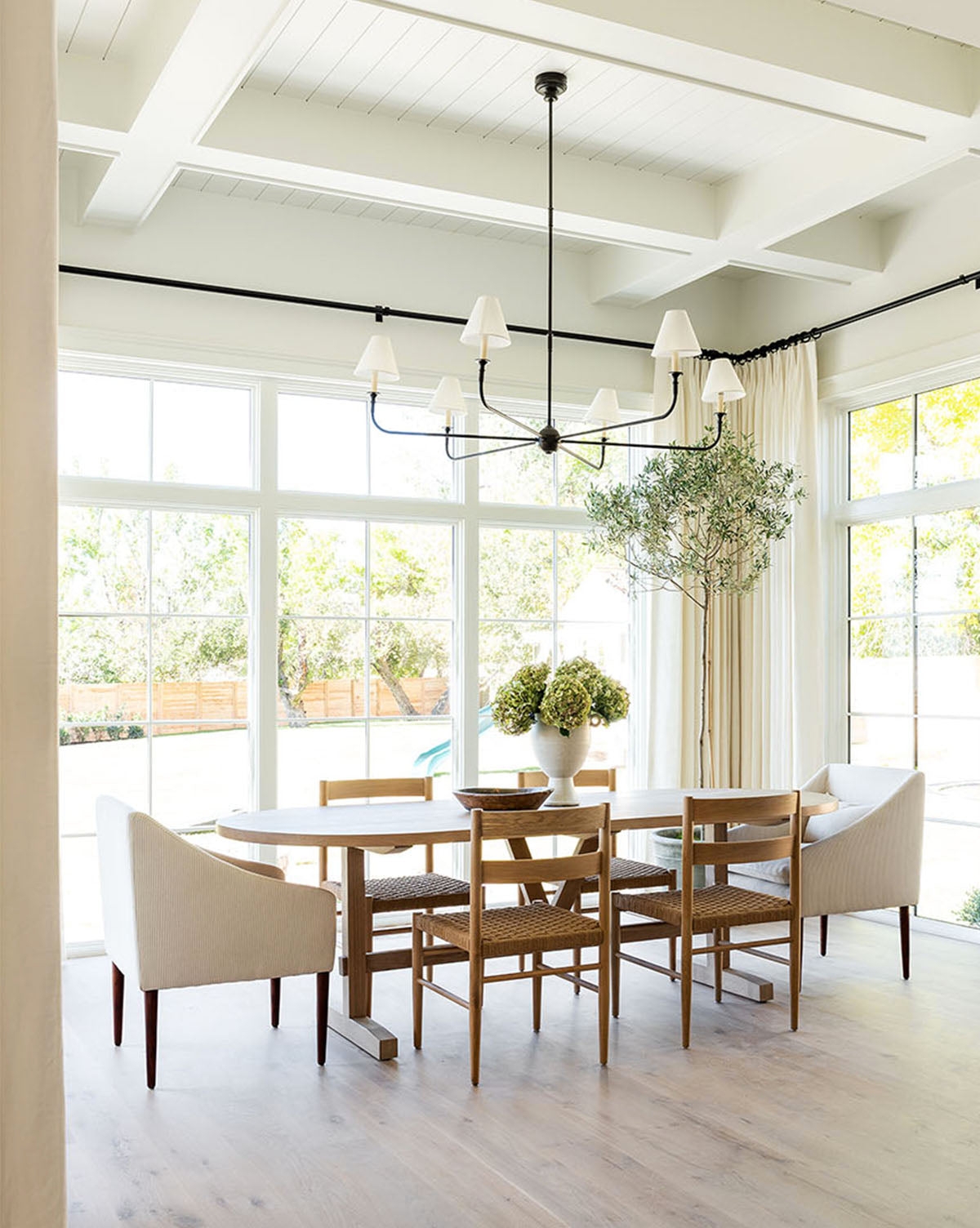 Oval Dining Table With Natural Wood Grain Trestle
