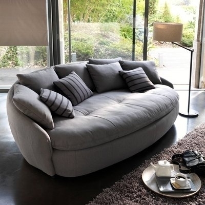 Oval Sofa with Deep Seating and Striped Pillows