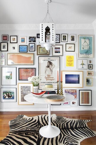 Pedestal Table Zebra Hide Rug and Maximalist Art Display