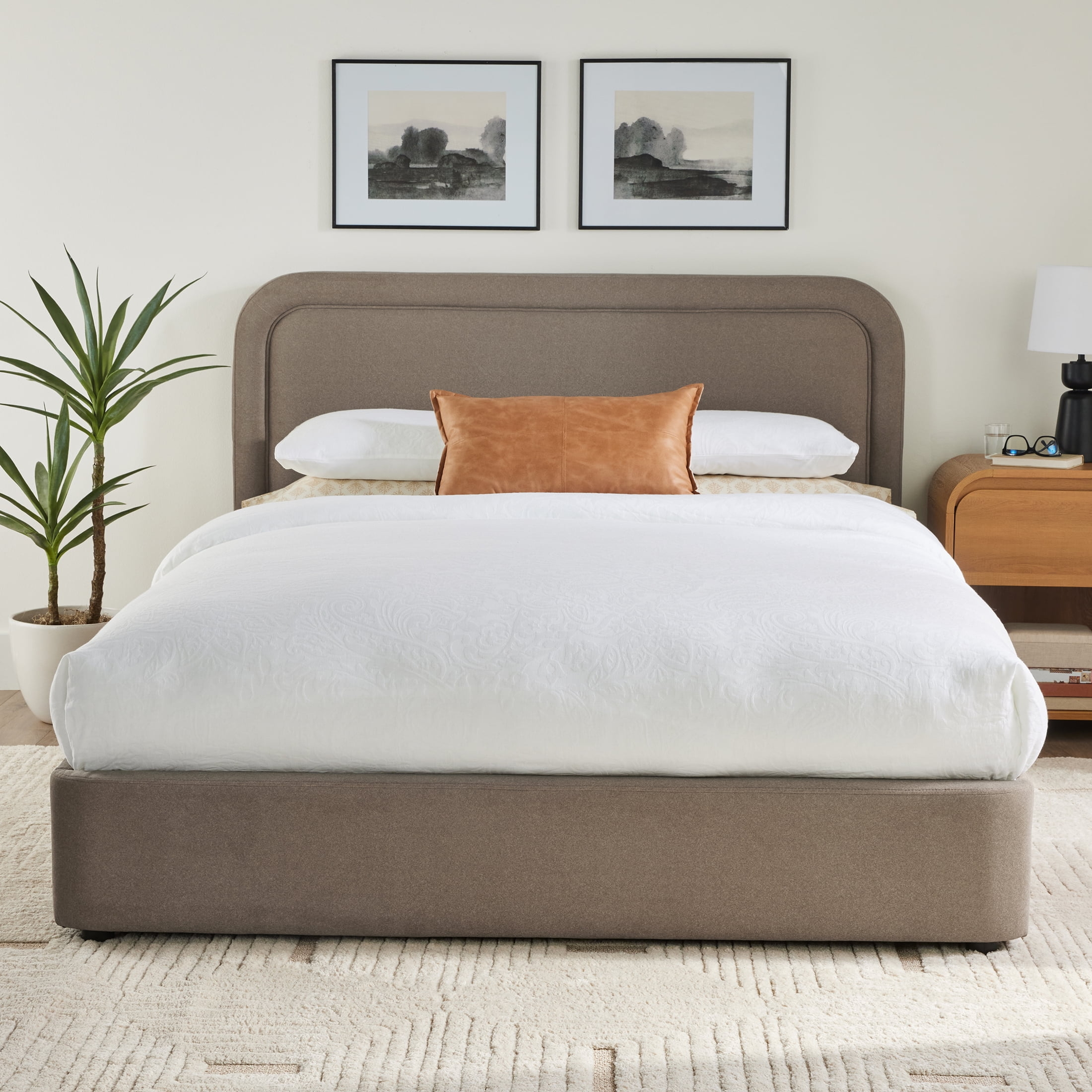 Platform Bed with Curved Headboard and Taupe Fabric Decor