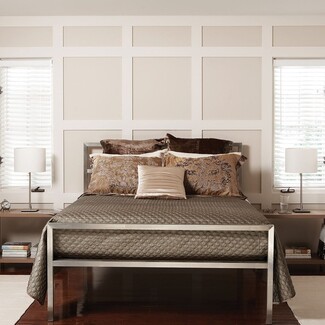 Platform Bed with Honeycomb Bedspread and Grid Wood Paneling