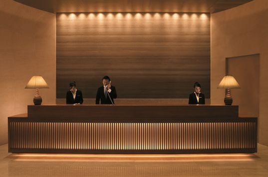 Reception Desk including Backlit Vertical Slats Lobby Design