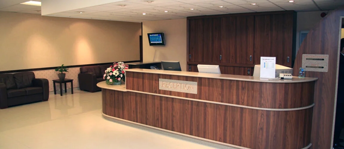 Reception Desk with Bespoke Curved Front and Recessed Signage
