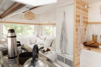 RV Interior with Horizontal Wood Slats and Light Trailer Walls