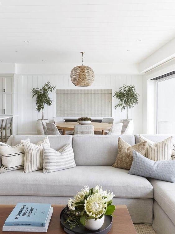 Sectional Seating with Woven Globe Pendant and Tonal Layering