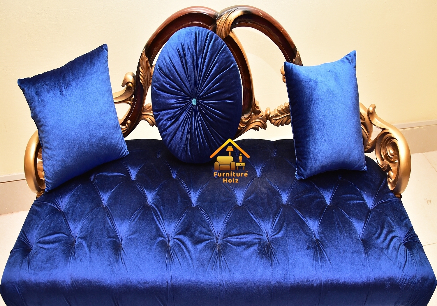 Settee with Ornate Gold Frame and Pinwheel Accent Pillow