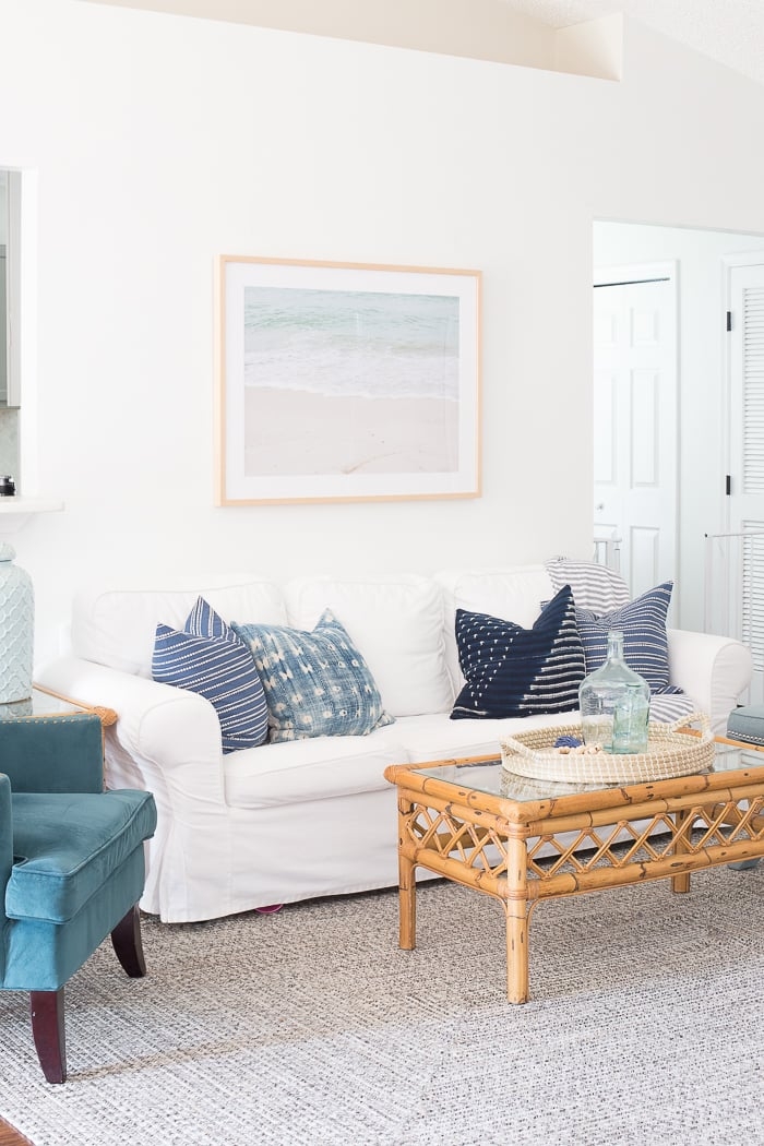 Slipcovered Seating with Rattan Coffee Table and Indigo Pillows