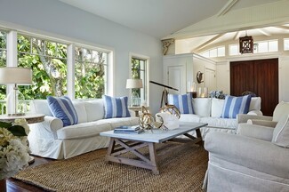 Slipcovered Sofa Blue Striped Pillows and white slipcovered sofa styling
