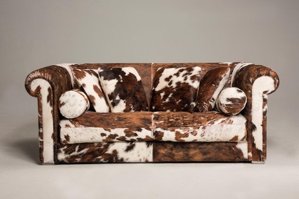 Sofa with Bolster Pillows and Mottled Cow Fur Hide