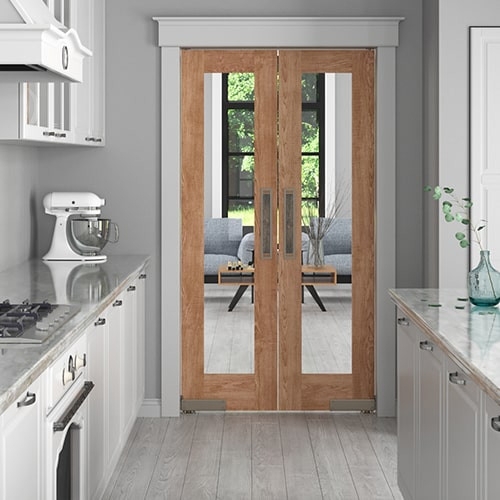 Swinging French Doors with Full Glass Panes in Warm Wood Finish