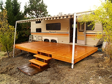 Travel Trailer - Glossy Wood Platform with Striped Awning