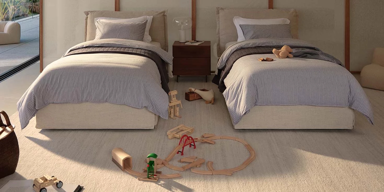 Twin Beds with Padded Headboard and Pinstripe Bedding